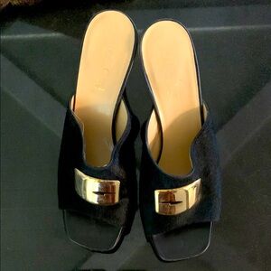 Vintage Black Fur Platform Gucci Mules with Luxurious Gold Metal Accent. Size 8.